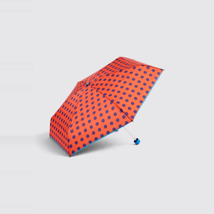 Paraguas mini plegable rojo con lunares azul marino de Gotta – foto 1