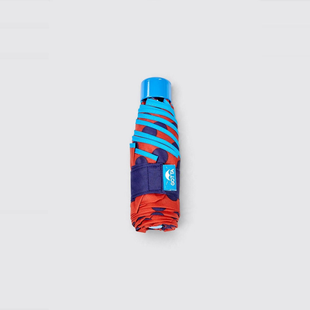 Paraguas mini plegable rojo con lunares azul marino de Gotta – foto 3
