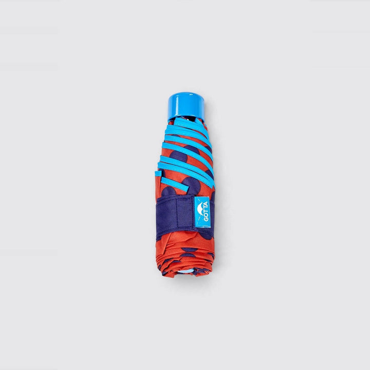 Paraguas mini plegable rojo con lunares azul marino de Gotta – foto 3