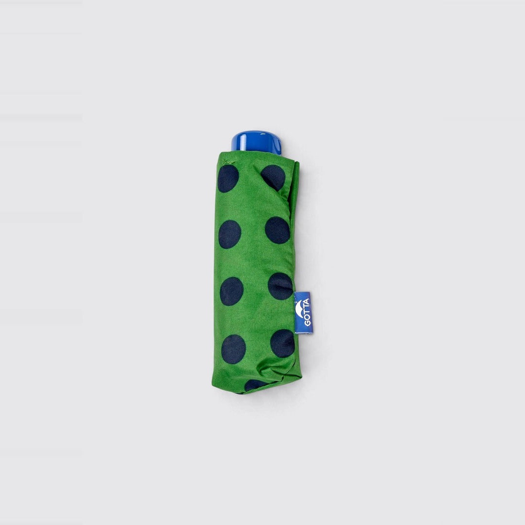 Paraguas mini plegable verde con lunares azul marino de Gotta – foto 2