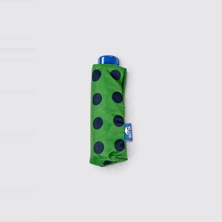 Paraguas mini plegable verde con lunares azul marino de Gotta – foto 2