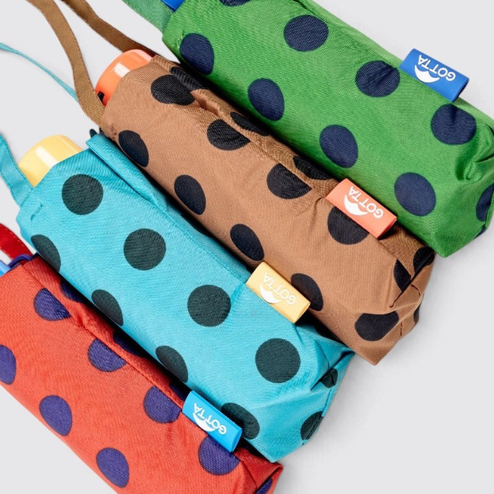 Paraguas mini plegable verde con lunares azul marino de Gotta – foto 4